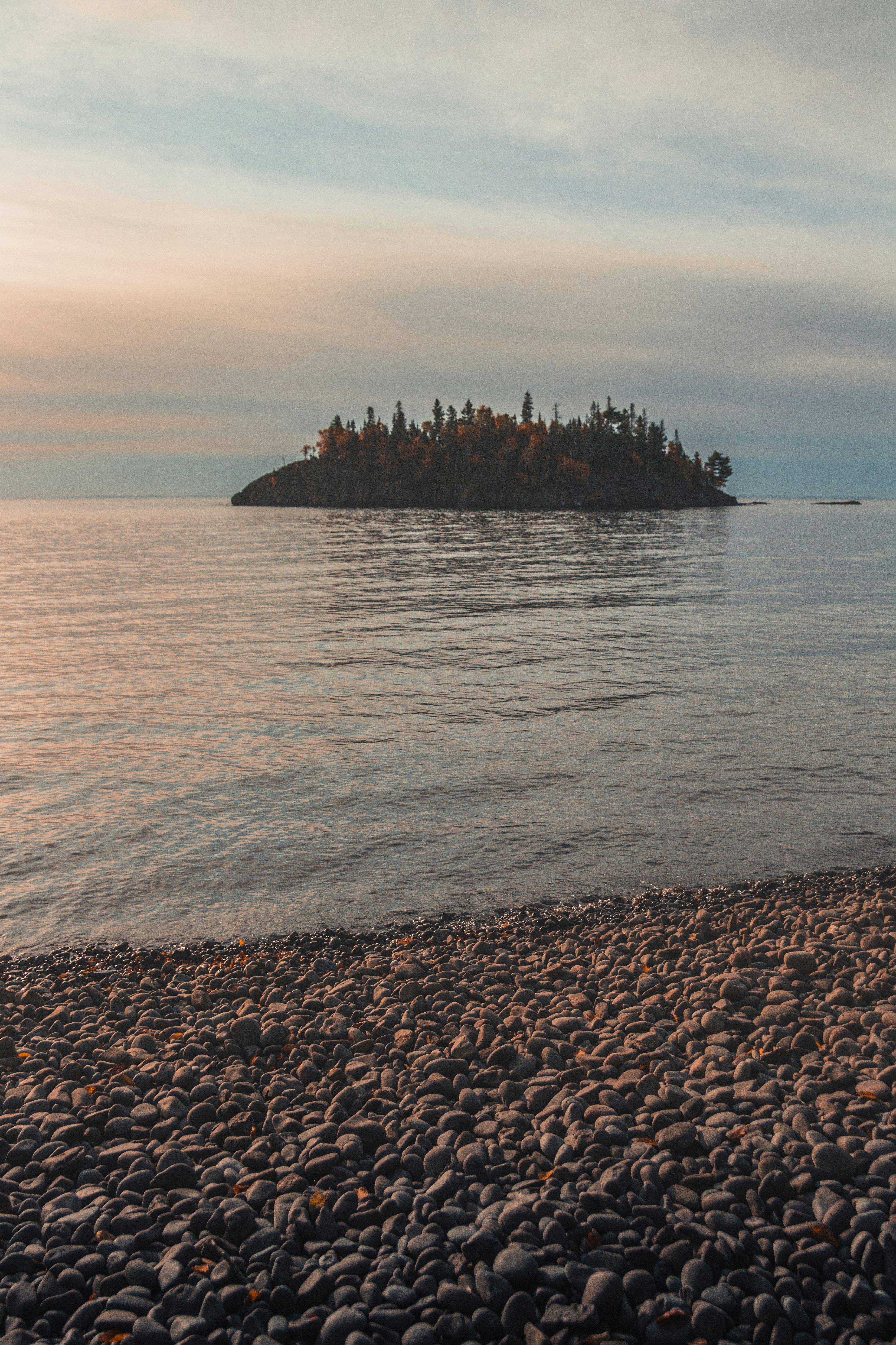 brown rock formation on sea during daytime